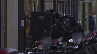 Police raids across Paris after ''terror'' suspect is shot by a soldier at the Louvre museum