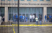 Staff stand within the United States embassy facility in Havana, Cuba on Se