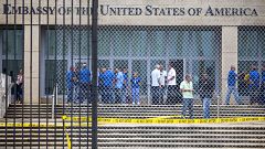 Staff stand within the United States embassy facility in Havana, Cuba on Se
