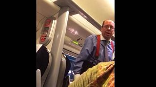 Watch: Woman films racist abuse from solicitor on train