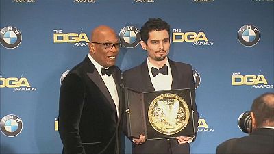 La La Land wins another top award as director Damien Chazelle criticises Donald Trump