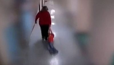 A teacher at Wurtland Elementary School is seen dragging a 9-year-old autistic student down the hallway in Greenup County, Kentucky.