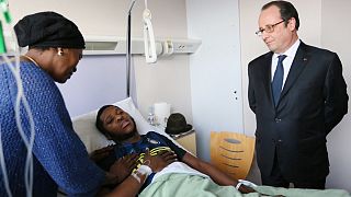 French President visits 'police rape victim'