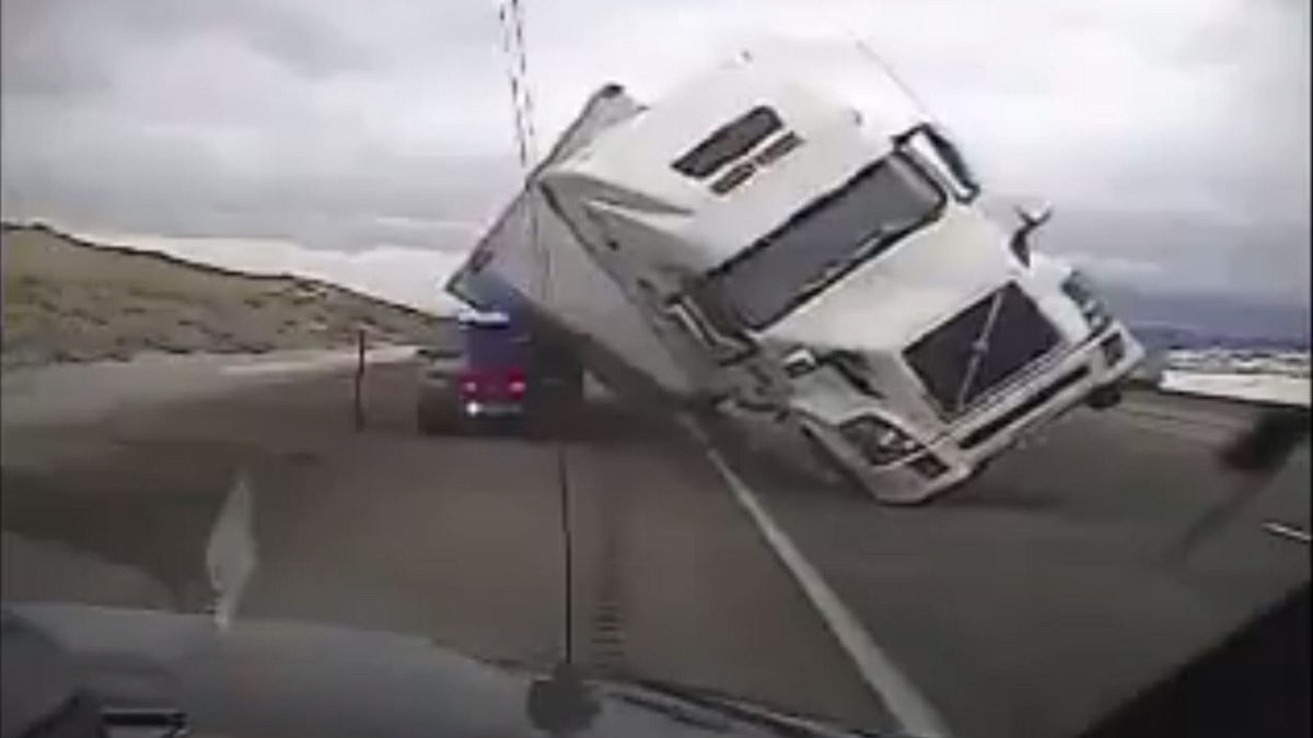 Truck lands on police car in high winds