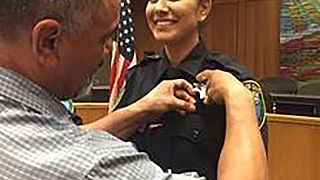 Image: Natalie Corona is sworn in the Police Department by her father, Merc