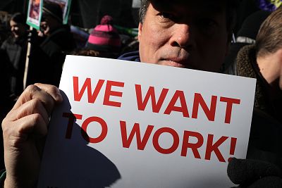 Hundreds of federal workers and contractors rally against the partial federal government shutdown Thursday outside the headquarters of the AFL-CIO in Washington.