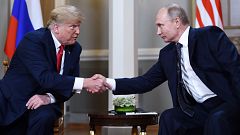 Image: Vladimir Putin  and Donald Trump shake hands before a meeting in Hel