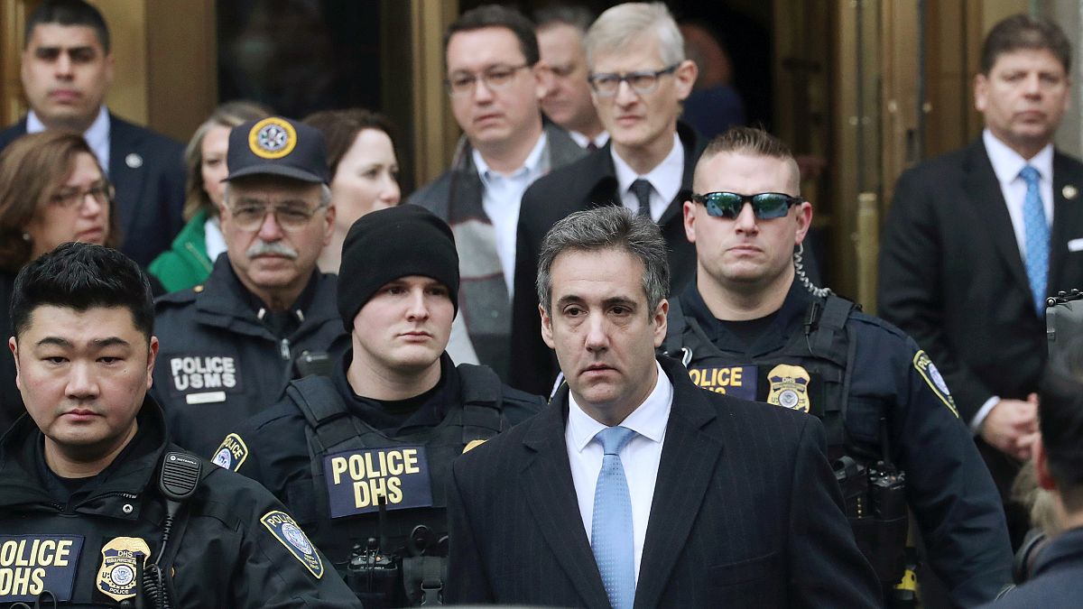 Michael Cohen exits the courthouse after his sentencing in New York