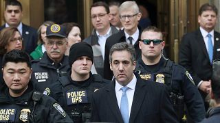 Michael Cohen exits the courthouse after his sentencing in New York