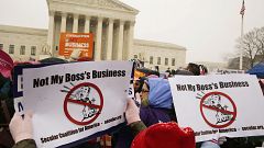 Protesters rally at the steps of the Supreme Court as arguments begin today