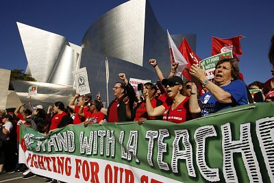 United Teachers Los Angeles leaders, joined by thousands of teachers, march past the Walt Disney Concert Hall in Los Angeles last month.