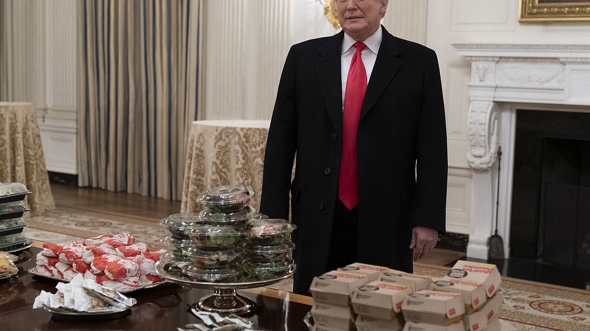 Image: United States President Donald J. Trump presents fast food to be ser