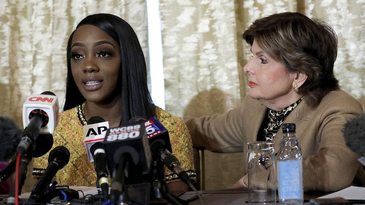 Image: Faith Rodgers speaks as attorney Gloria Allred listens during a pres