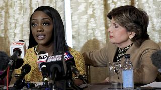 Image: Faith Rodgers speaks as attorney Gloria Allred listens during a pres