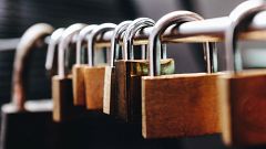 Close-Up Of Padlocks On Railing