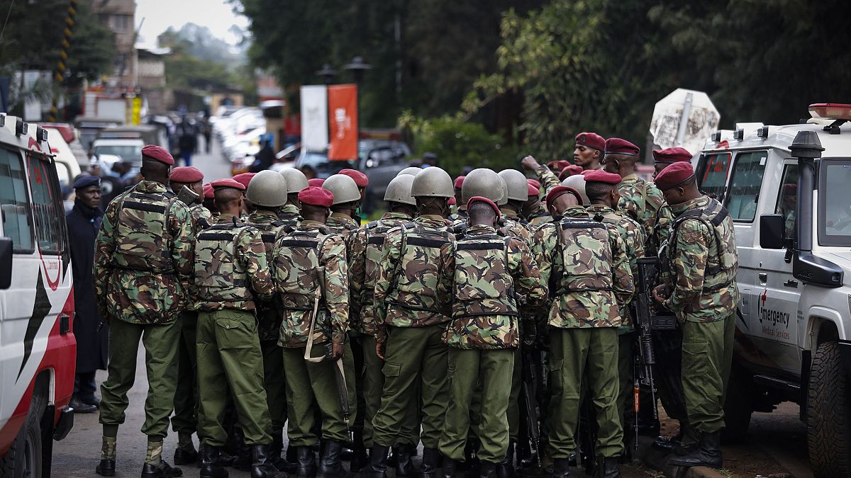 Image: Kenyan police officers prepare enter the complex in Nairobi on Tuesd