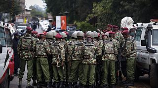 Image: Kenyan police officers prepare enter the complex in Nairobi on Tuesd