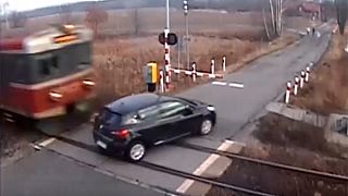 Watch: Train ploughs into car at level crossing in Poland