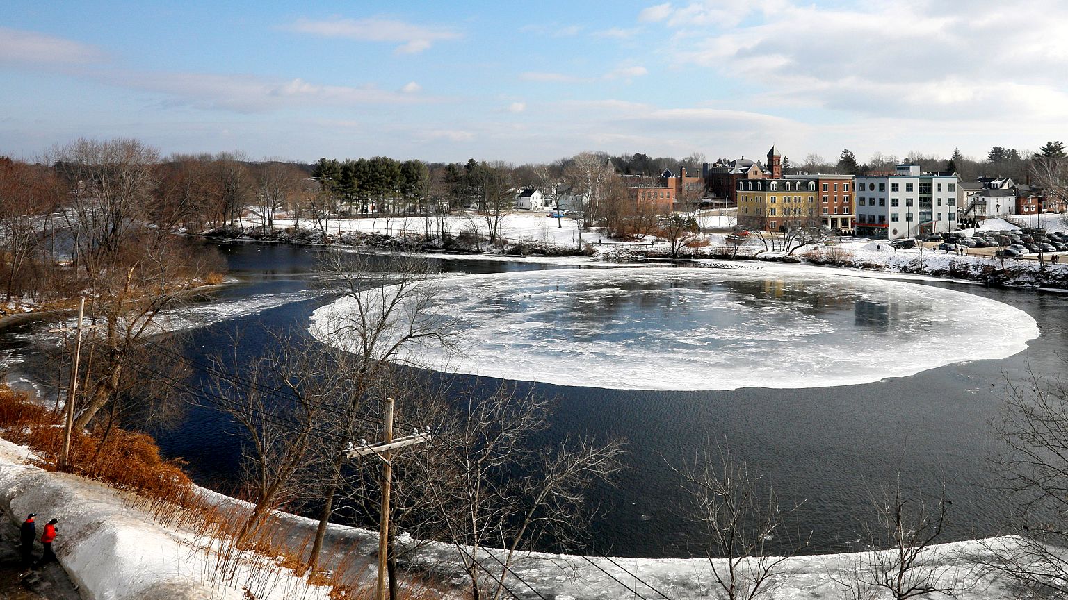 Image: A large, circular ice floe spins slowly in the Presumpscot River in 