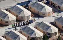 Image: Immigrant children housed in a tent encampment under the new "zero t