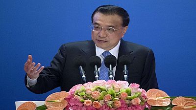 China trims GDP target, citing severe challenges