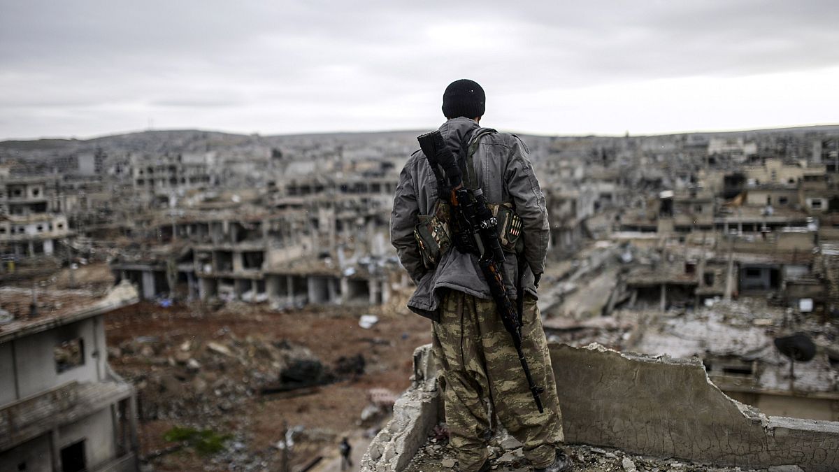 Image: A Kurdish marksman in Kobane, Syria