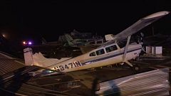 Plane flipped over after storm hits airport