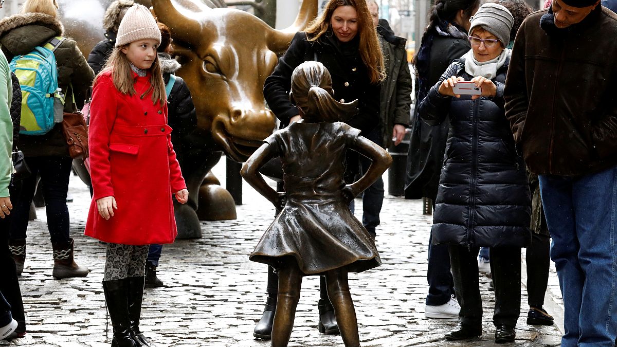 On International Women's Day, a bronzed girl defies Wall Street bull