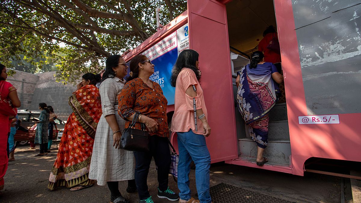 Image: Women wait to use the Shaniwar Wada bus toilet for women in Pune, In