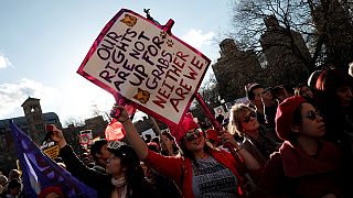 Women's Day marchers target Trump on abortion and pay gap