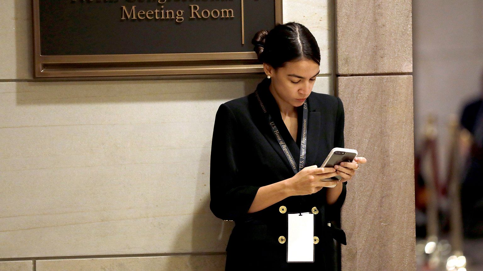 Incoming Representative Alexandria Ocasio-Cortez waits for a House of Repre