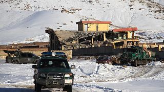 Image: An Afghan military vehicle near a site after a car bomb attack on a 