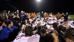 Image: Bremerton assistant football coach Joe Kennedy, obscured at center i