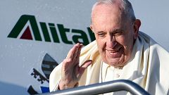 Image: Pope Francis waves before taking the plane to participate to the Wor