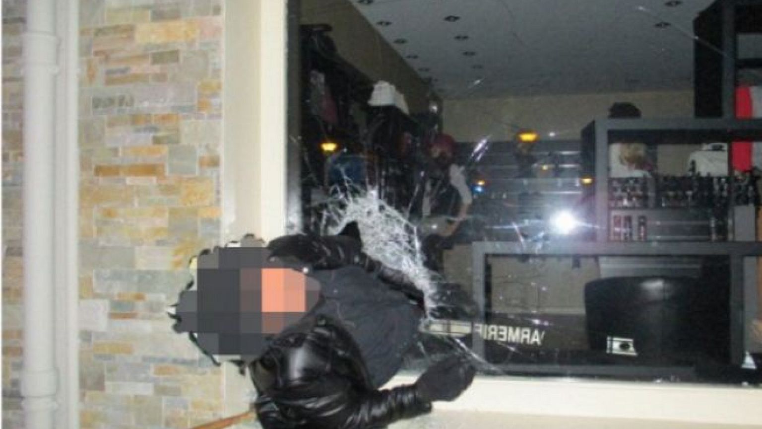 French police catch thief trapped in jewellery store window