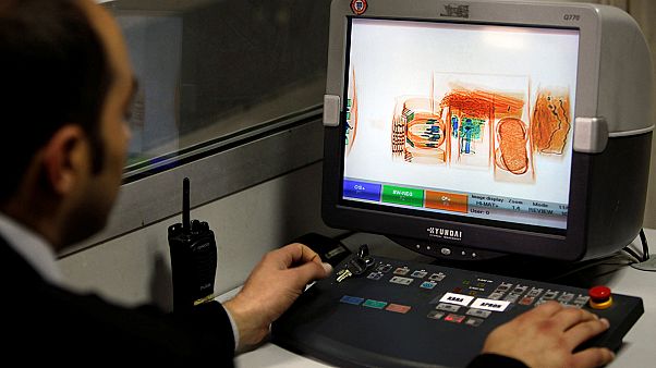 Passengers complain at new ban on flight carry-on electronic devices Passengers complain at new ban on flight carry-on electronic devices