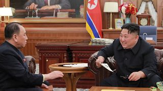 Image: North Korean leader Kim Jong Un talking with Kim Yong Chol