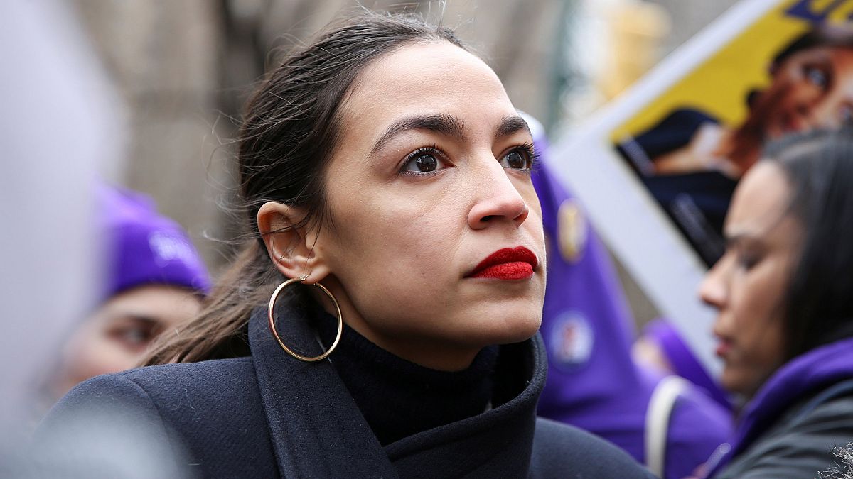 Image: Rep. Alexandria Ocasio-Cortez looks on during a march organised by t