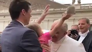 Watch: Cheeky little girl snatches Pope's skullcap