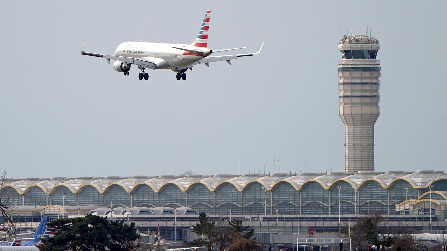 Image: An airplane and air traffic control tower on the 22nd day of the par