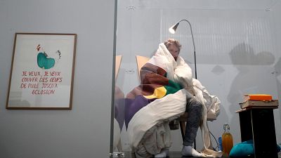 French performance artist attempts egg hatching