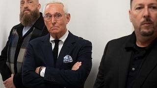 Image: Political Strategist Roger Stone stands outside the hearing room pri