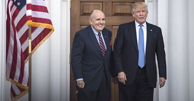 Donald Trump greets Rudy Giuliani at the clubhouse at Trump National Golf Club Bedminster in Bedminster Township, New Jersey on Nov. 20, 2016.