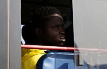 Gambian migrants return home after Libyan prison ordeal