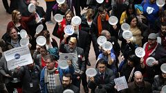 Furloughed federal workers and those aligned with them protest the partial 