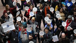 Furloughed federal workers and those aligned with them protest the partial 