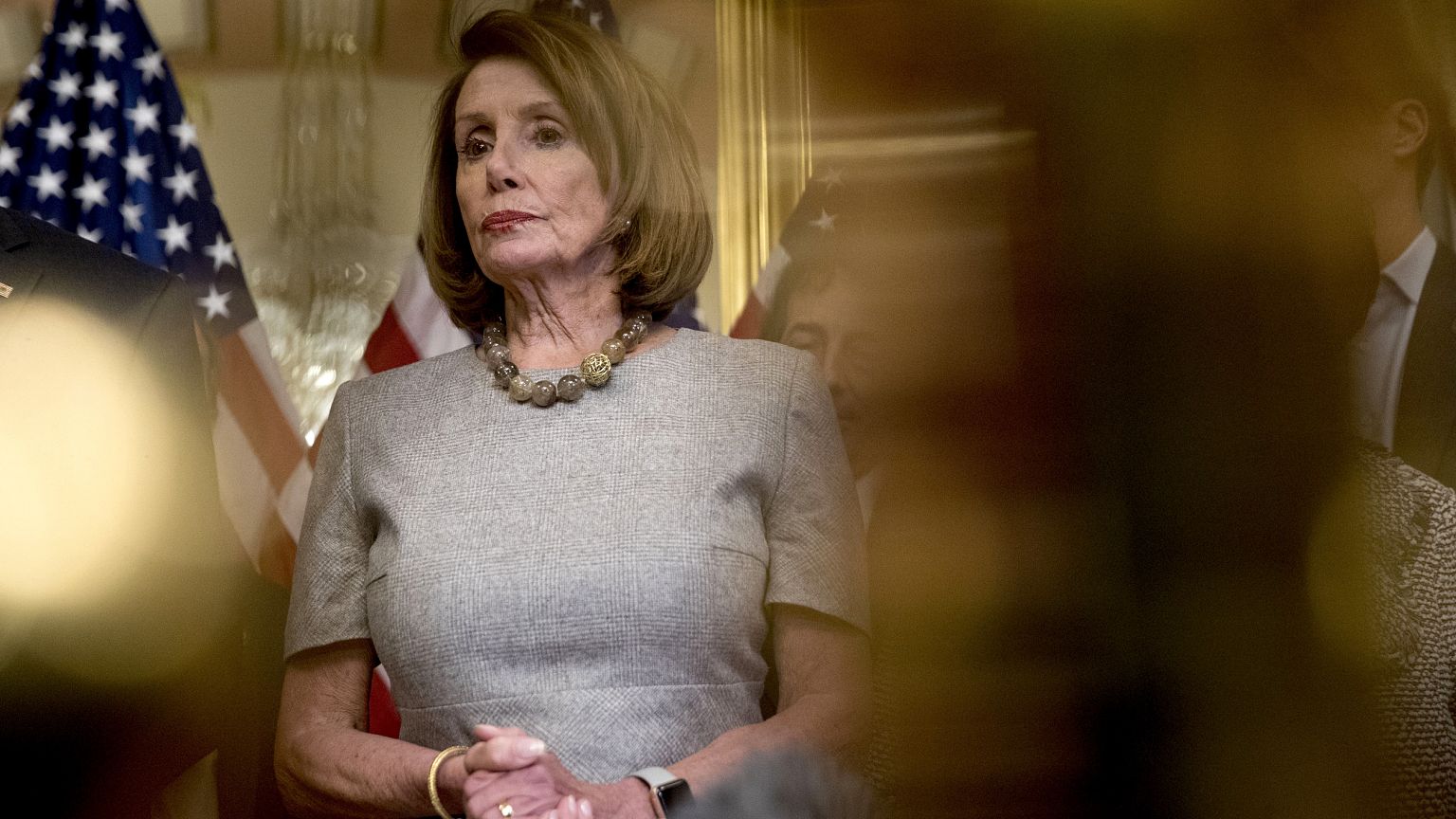Image: Speaker of the House Nancy Pelosi listens to reporters on Capitol Hi