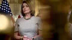 Image: Speaker of the House Nancy Pelosi listens to reporters on Capitol Hi
