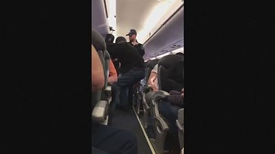 Passenger dragged off overbooked United Airlines flight