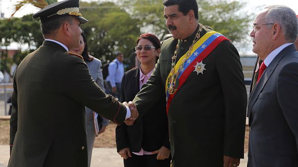 Venezuelan President Maduro pelted by angry crowd at rally Venezuelan President Maduro pelted by angry crowd at rally
